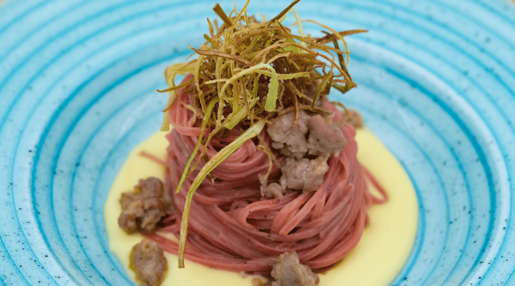 Truffle & Barolo Tagliolini with Sausage, Potato Cream & Crispy Leeks